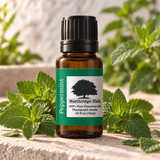 Northridge Oak Peppermint Essential Oil 10 mL with fresh peppermint leaves