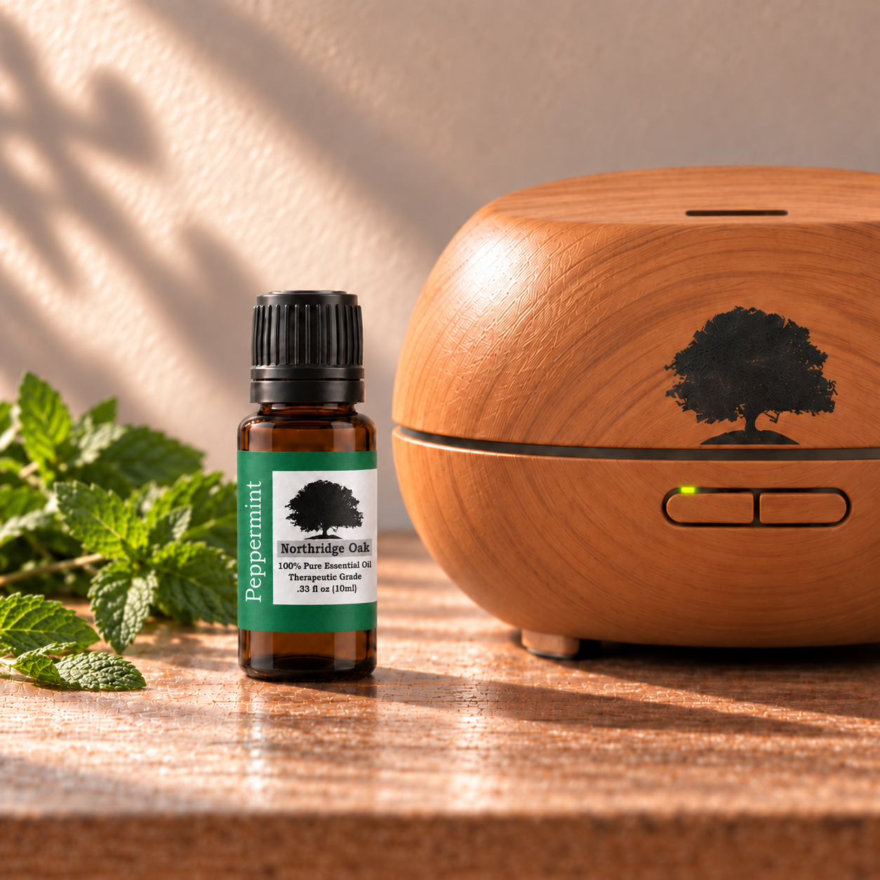 Northridge Oak Peppermint Essential Oil beside a wood grain diffuser
